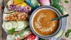 vegan-summer-rolls-on-large-plate-with-peanut-sauce-in-the-middle