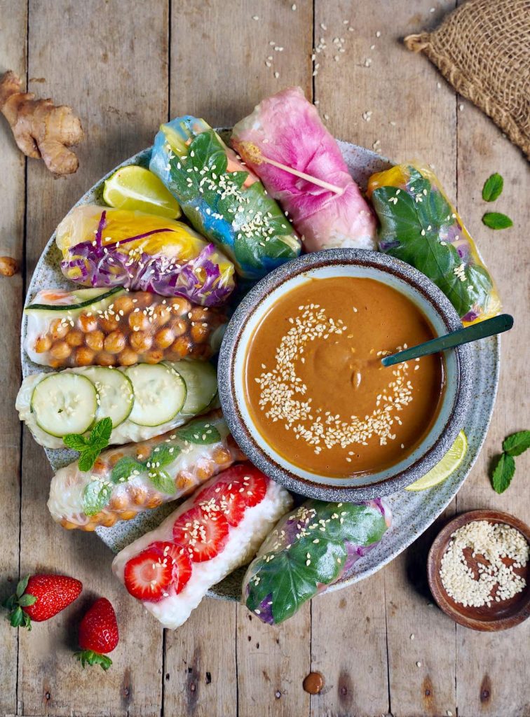vegan-summer-rolls-on-large-plate-with-peanut-sauce-in-the-middle